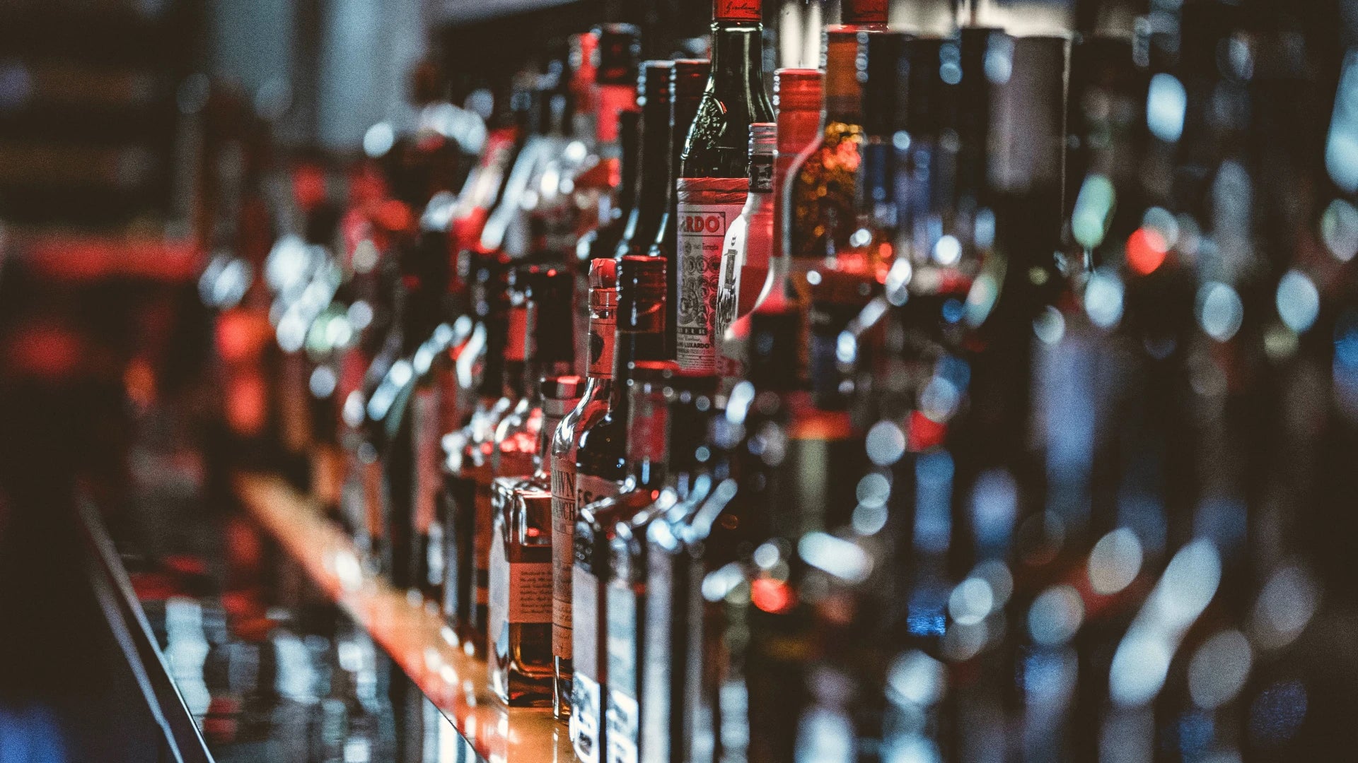 liqueurs bottles lined up in a bar