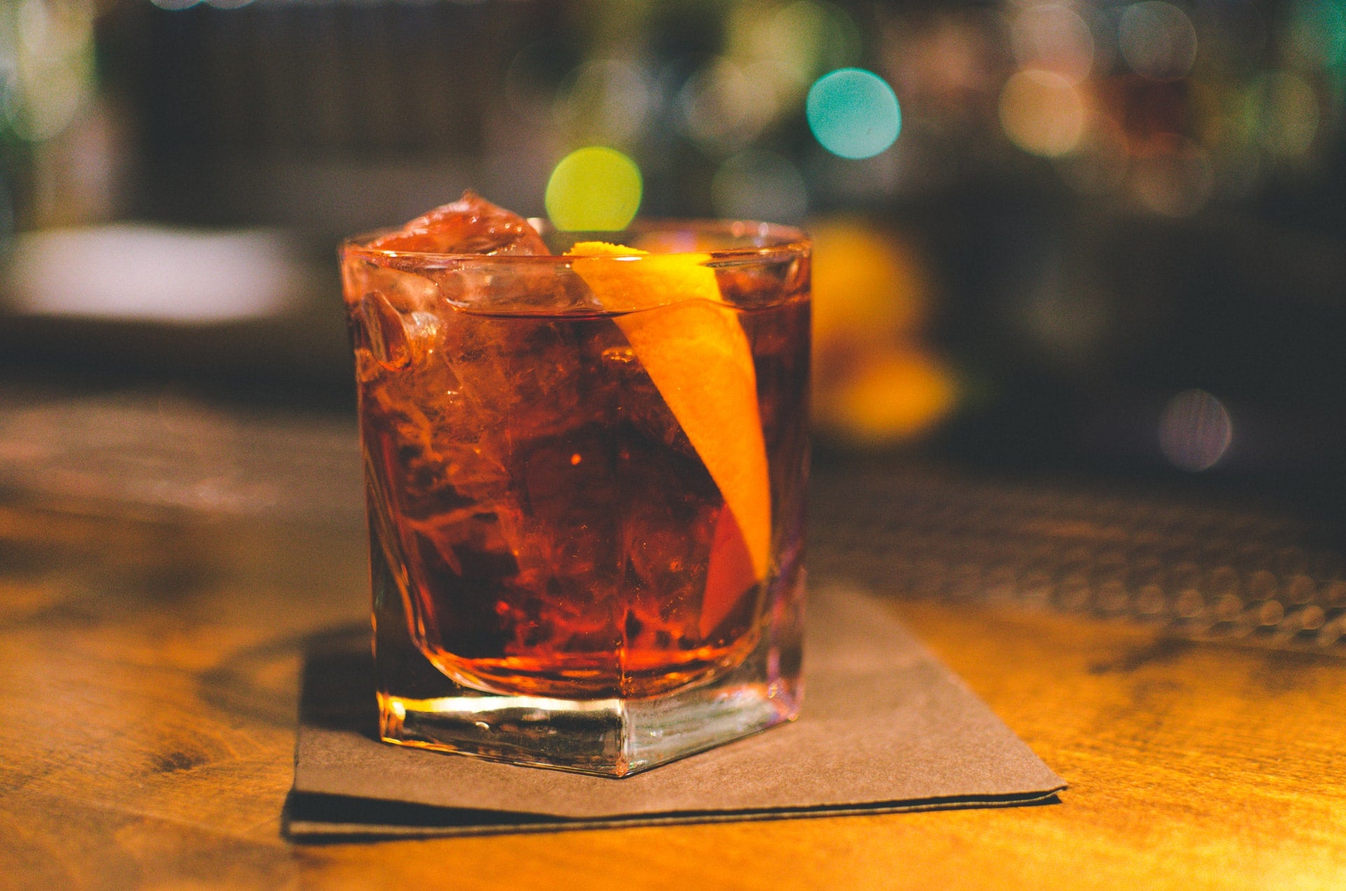 ALT: cocktail with orange garnish