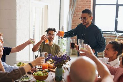 group of friends enjoying cocktails on friendsgiving